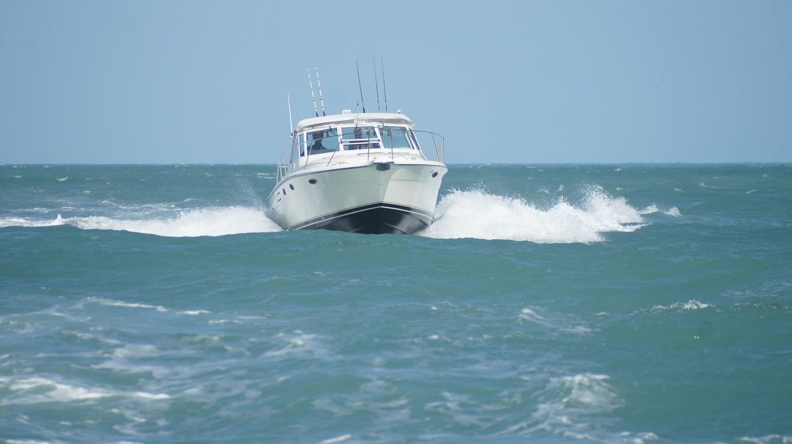 Picture of a boat preparing to enter an inlet.